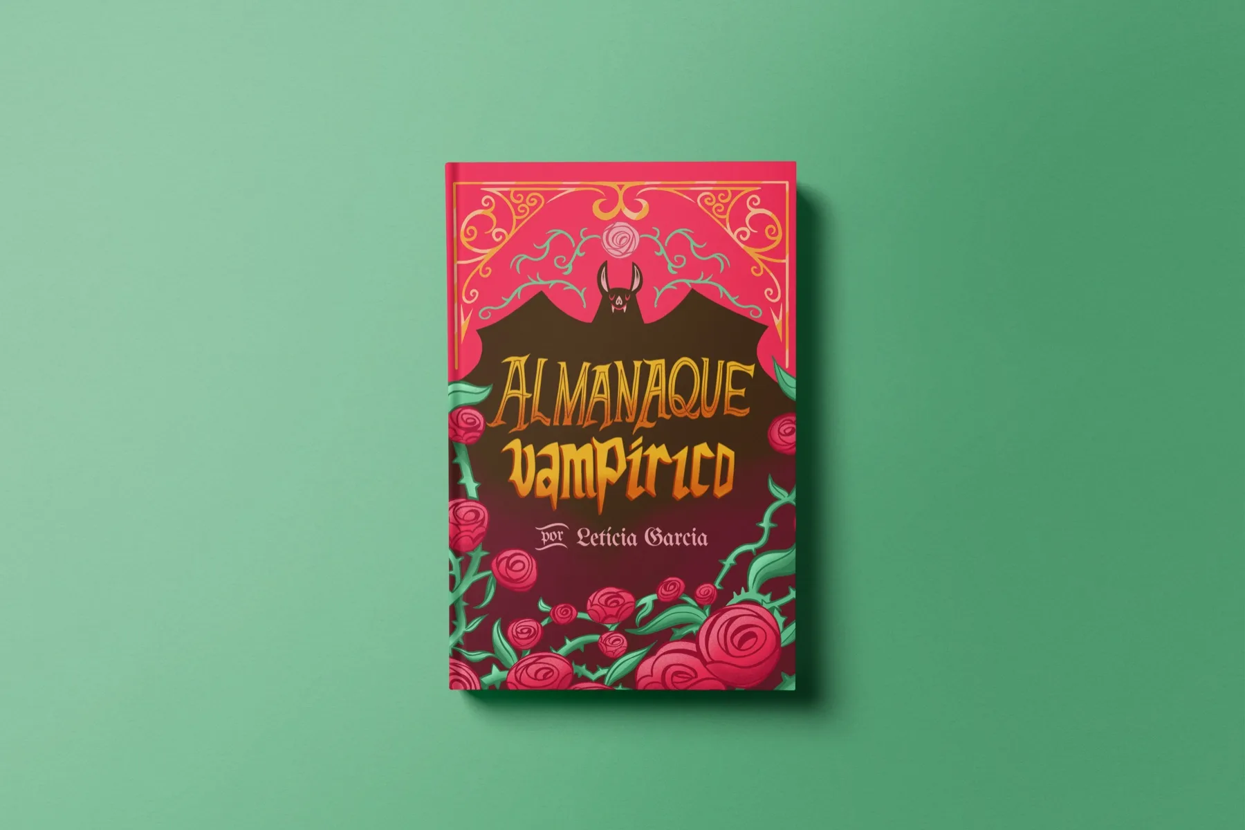 Mockup do Almanaque Vampírico sobre fundo verde: capa vermelha ilustrada com um morcego e rosas